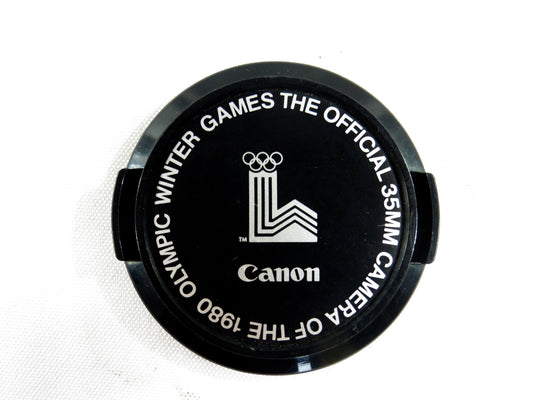 Canon bouchon officiel des jeux Olympiques d'Hiver 1980.The Official 35mm Camera of the 1980 Olympic Winter Games.Original Cap.Diamètre 52mm.